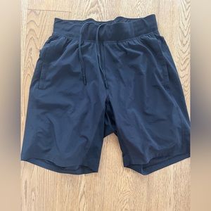 Lululemon “T.H.E. Short”. 9” with liner. Size medium. Black.